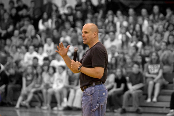 Keith presenting anti bullying and character education assembly to high school students in gym