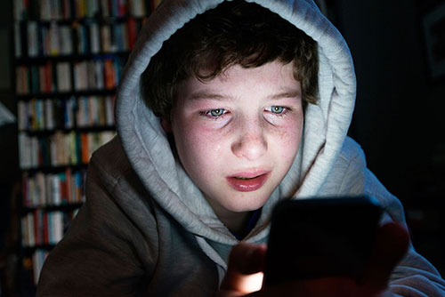 Middle school boy being cyberbullied 