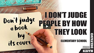 don’t judge a book by its cover – no racism,  prejudice, or bullying – open book with hand writing title